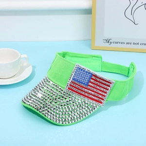 Detail of neon green visor hat with silver rhinestones and American flag patch decoration