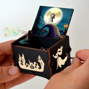 Handcranked wooden music box with colorful Nightmare Before Christmas illustrations