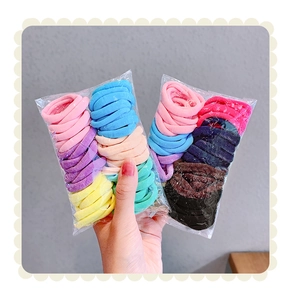 Close-up of assorted candy-colored elastic hair ties with textured ribbed weaving detail