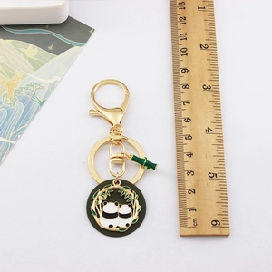 Detailed view of the 10cm panda keychain with a ruler showing the exact product size