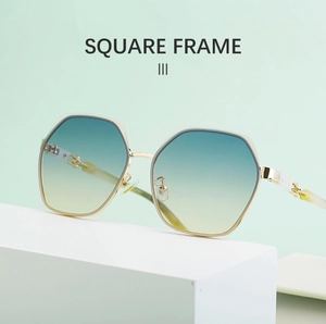 Close-up of square metal frame sunglasses with blue-yellow gradient lenses on display