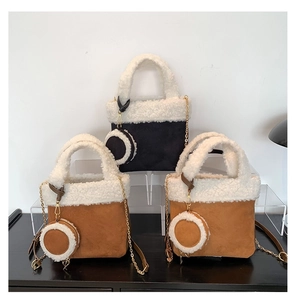 Plush faux shearling and suede bucket bags with matching round coin purses and gold chains