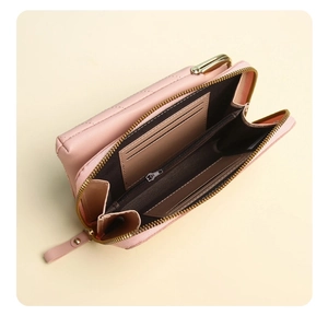 Detail view of pink PU leather quilted phone wallet showing internal card slots and zipper