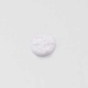 Macro shot of 6mm white resin rhinestone with irregular star-studded texture and flat base