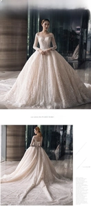 Exquisite sequin embroidery and sheer mesh neckline on a luxury cathedral train bridal gown