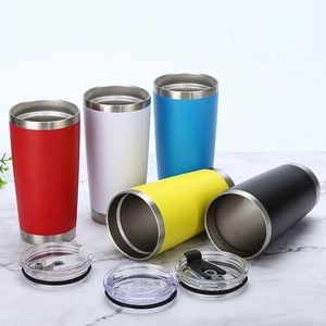 Detail view of colorful 20oz stainless steel tumblers with clear lids on marble surface