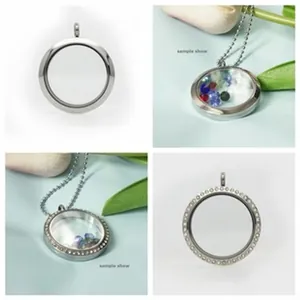 Detail of round glass locket pendants with rhinestone borders and smooth steel finish