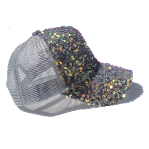 Detailed macro view of colorful shimmering sequins on a silver mesh trucker baseball hat