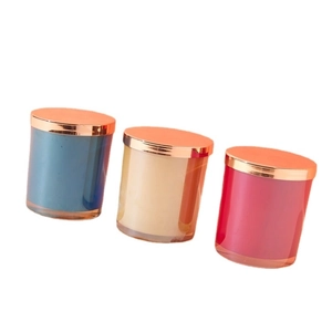 Luxury electroplated glass candle jars in blue, beige, and red with gold metal lids