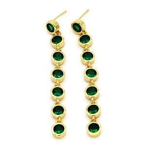 Detailed view of long gold drop earrings with seven round green zircon stones in a vertical row