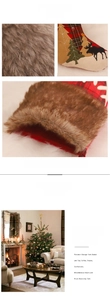 Close-up of red plaid Christmas stocking with brown faux fur trim and reindeer applique