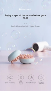 Detail of soft pink silicone bristles on light blue scalp massager for deep cleansing