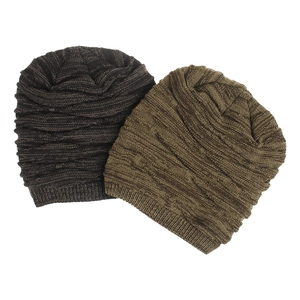 Close-up of diamond knit texture on brown winter beanies with soft fleece lining