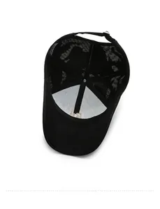 Internal view of black cotton baseball cap showing mesh lining and metal buckle adjustment