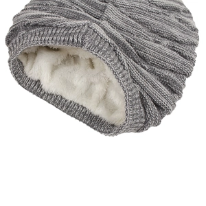 Detailed view of gray cable knit beanie with thick white thermal fleece lining
