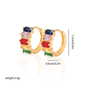 Detailed view of gold hoop earrings with multi-colored rectangular zircon stones