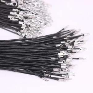 Bulk display of black woven necklace cords with silver lobster clasps for DIY jewelry making