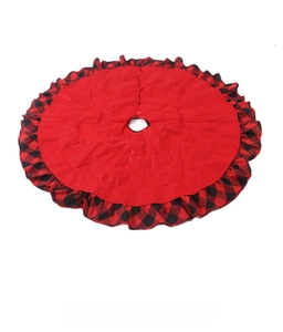 Detail of red Christmas tree skirt featuring a rustic buffalo plaid ruffled border decoration