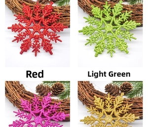Glittering 10cm snowflake ornaments in red, green, pink and gold for Christmas decor