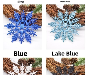 Close-up of sparkling 10cm Christmas snowflake ornaments in blue and silver glitter