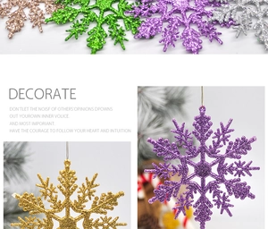 Close-up of 10cm Christmas snowflake ornaments with various glitter finishes and hanging strings