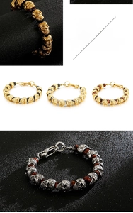 Macro detail of skull beaded bracelet with tiger eye stones and lobster clasp closure