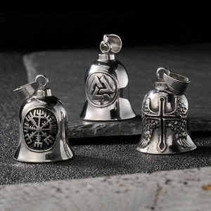 Detailed close-up of stainless steel Viking bells with engraved Valknut and cross symbols