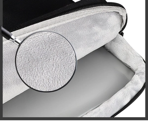 Close-up of soft thickened gray plush lining and smooth zipper on black laptop sleeve
