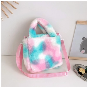 Detail of colorful tie-dye plush handbag featuring soft fur and adjustable pink strap
