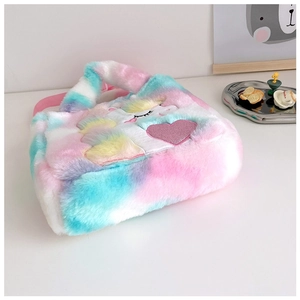 Detail view of rainbow plush unicorn handbag with cute pink heart and embroidery