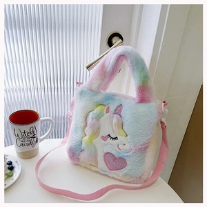 Detailed view of rainbow plush unicorn handbag with soft texture and pink adjustable strap