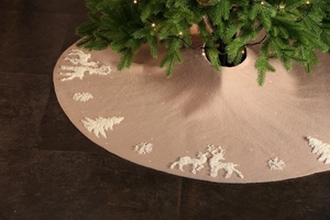 Close-up of pink knitted Christmas tree skirt featuring 3D embroidered reindeer patterns