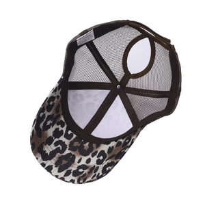 Detail view of leopard print ponytail baseball cap showing mesh back and inner wash label
