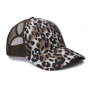 Close-up of leopard print baseball cap featuring breathable brown mesh and reinforced seams