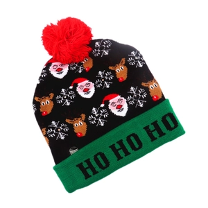 Detail of LED Christmas beanie with green cuff, red pompom and ON/OFF switch button