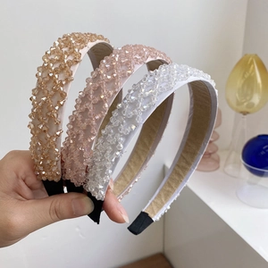 Detail of three-piece crystal beaded headbands showing intricate hand-woven craftsmanship