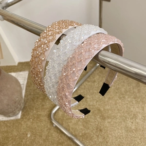 Detailed set of three wide beaded crystal headbands in champagne, white and pink