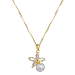 Elegant gold titanium jewelry set featuring a pearl flower pendant with crystal accents
