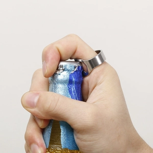 Silver stainless steel bottle opener ring used to open a beer bottle on a white background