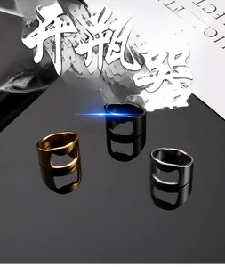 Macro shot of titanium steel bottle opener rings in gold, black, and silver finishes