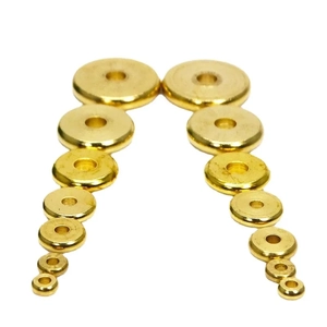 Flat solid brass spacer beads set for DIY jewelry in various sizes on white background