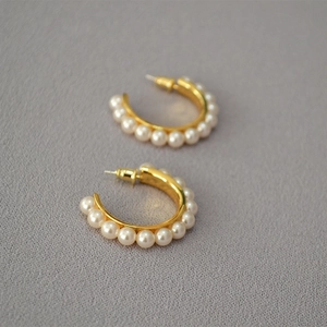 Elegant gold-plated C-shape hoop earrings featuring row of white pearls for women