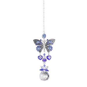 Detail of silver butterfly suncatcher with blue evil eye beads and crystal prism ball