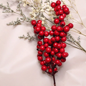 Artificial Christmas red berries branch for holiday wreaths and festive home decoration