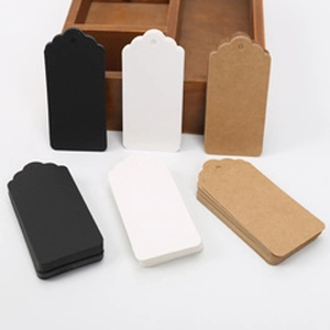 Blank heart-shaped kraft tags in black, white, and brown with decorative scalloped edges