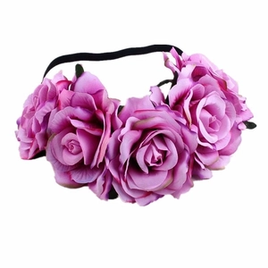 Detailed view of the vibrant purple artificial rose petals on a bohemian flower headband