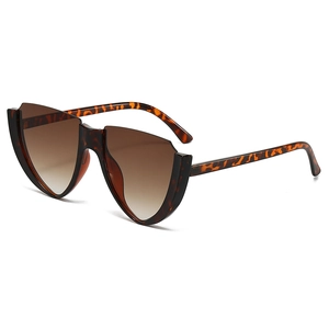Cat eye sunglasses with leopard print frame and brown gradient lenses in 45-degree view