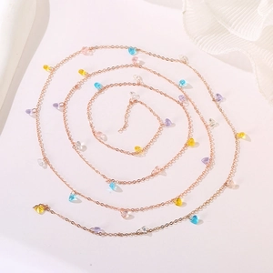 Artistic spiral view of rose gold necklace with colorful heart-shaped crystal charms