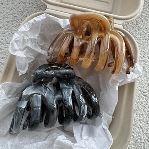 Large ink texture marble hair claw clips in amber and grey marble colors for thick hair