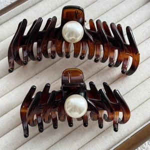 French vintage amber hair claws with pearl accents, stylish large shark hair clips for women